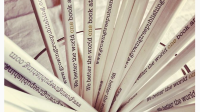 White wood pencil ‘we better the world one book at a time’